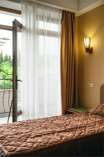 Фото номера Стандартный двухместный номер с 1 кроватью или 2 отдельными кроватями Гостиница Эдем г. Алушта 6