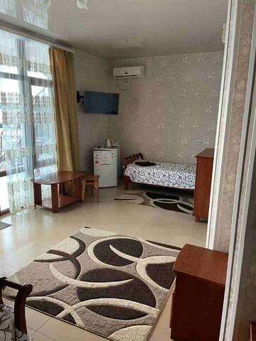 Фото номера Четырехместный номер с видом на море Гостиница Ostrovok Hotel г. Алушта 13
