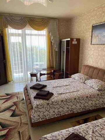 Фото номера Трехместный номер боковой с видом на море Гостиница Ostrovok Hotel г. Алушта 14