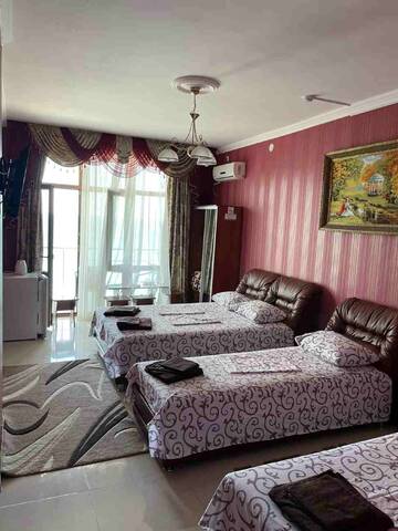 Фото номера Четырехместный номер с видом на море Гостиница Ostrovok Hotel г. Алушта 2